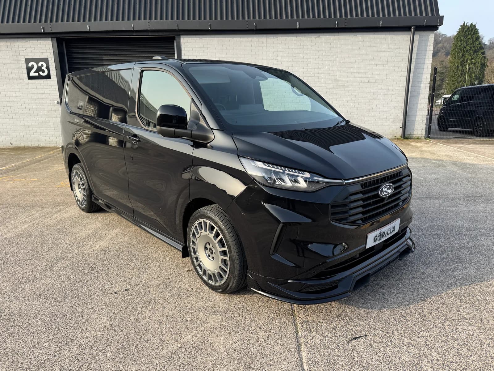 Black L1 Ford Transit Custom GV Sport Panel Van, front three-quarter view