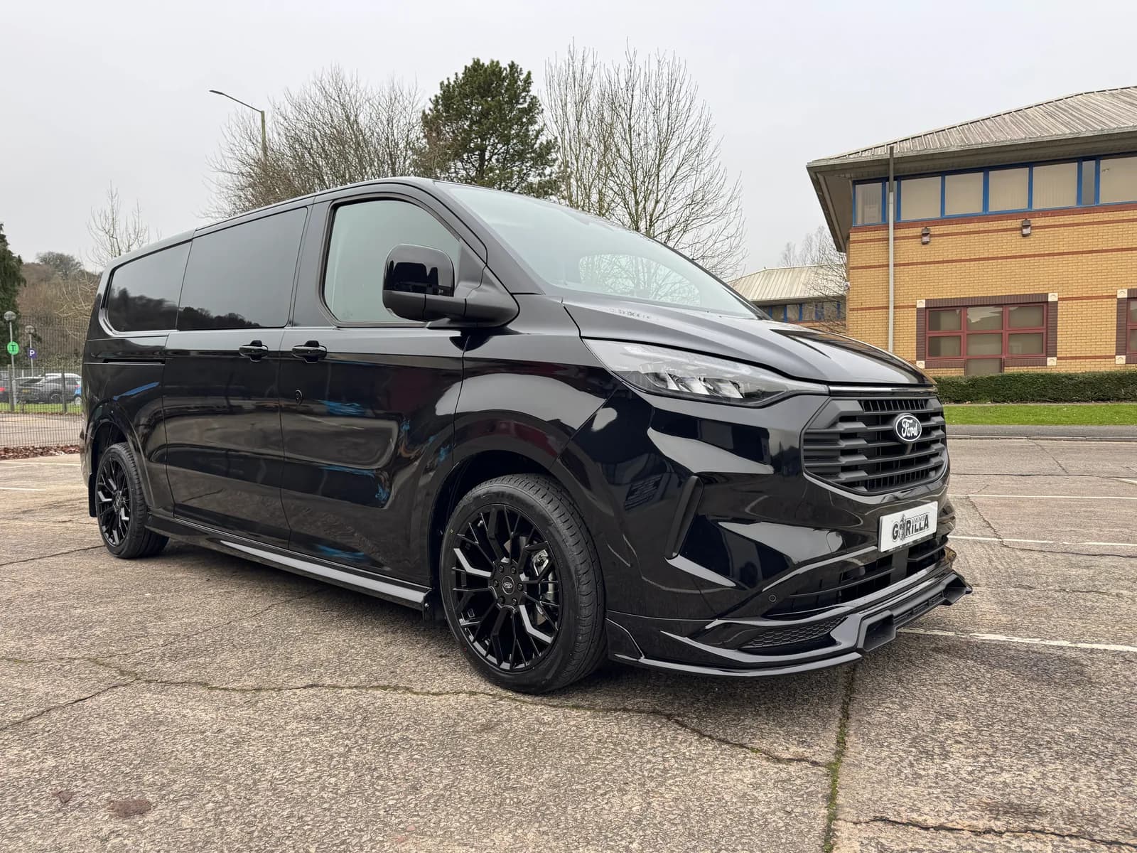 Black L2 Ford Transit Custom GV Sport Double Cab, front three-quarter view