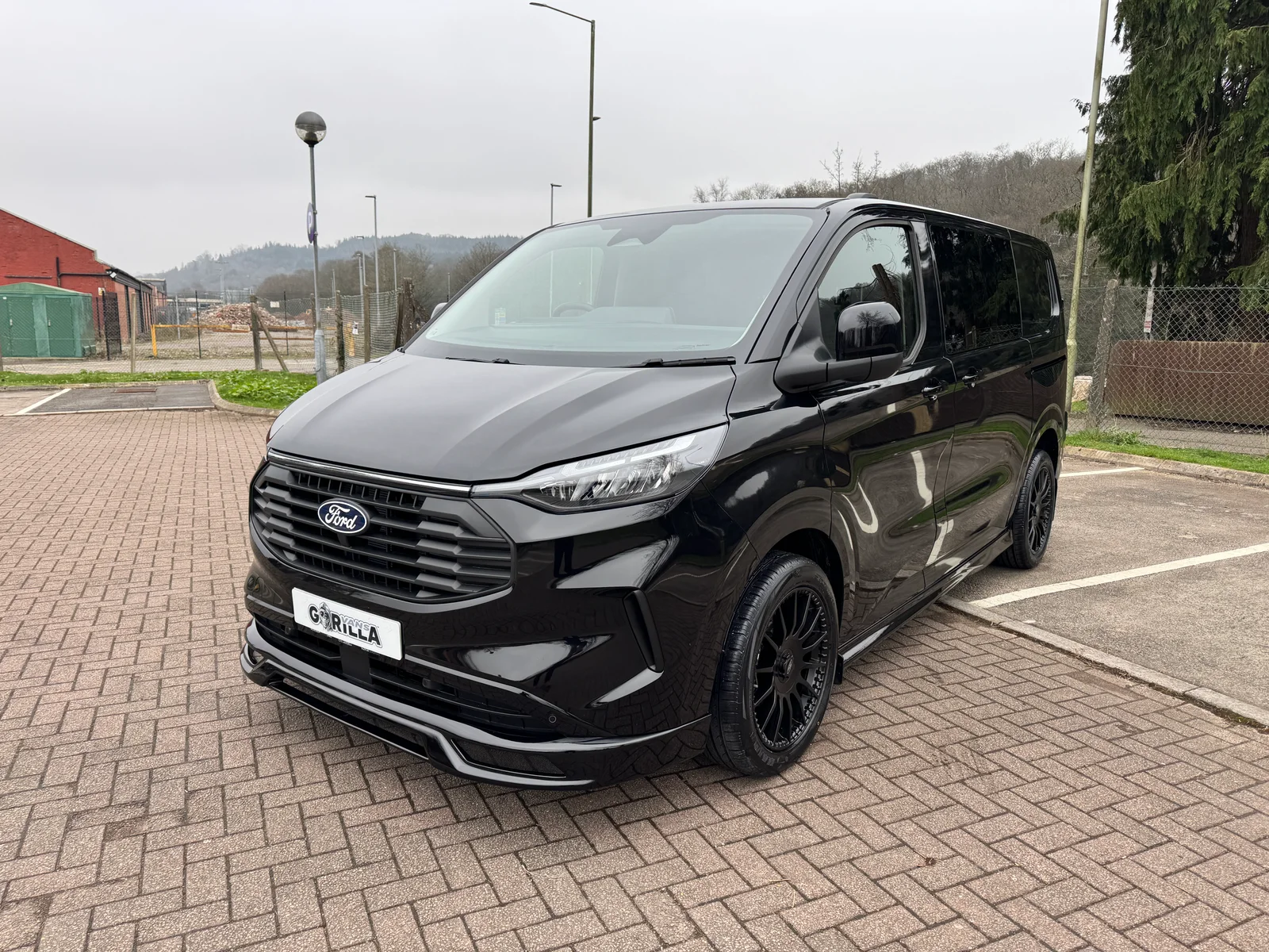 Ford Transit Custom L1 DCIV GV Sport in Agate Black — front three-quarter